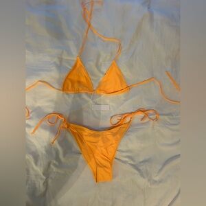 Vibrant yellow bikini from Bright Swimwear. Size large, HOWEVER, came size small